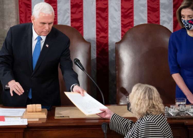 U.S Congress Approves New Election Certification Rules 1 US Vice President Mike Pence hands the electoral certificate from the state of Arizona to US Representative Zoe Lofgren (D-CA) as he presides over a joint session of Congress to certify the 2020 election results on Capitol Hill in Washington, U.S., January 6, 2021.