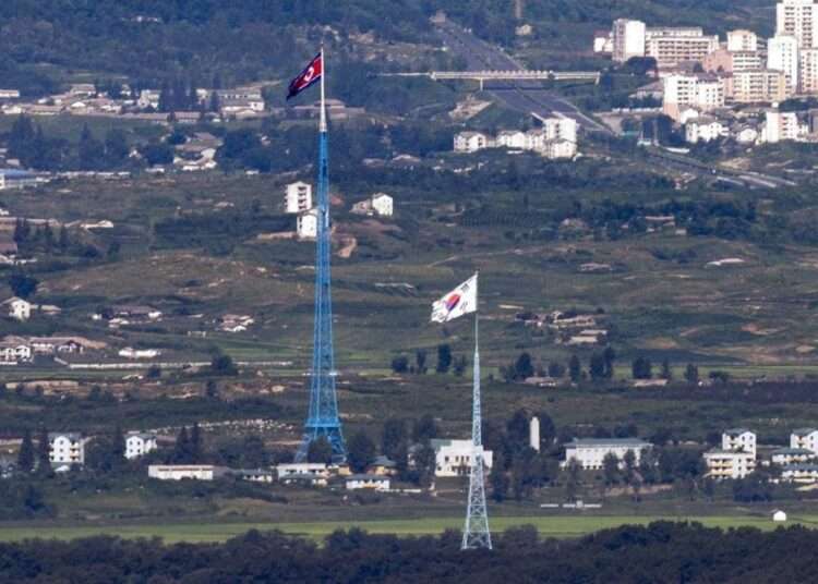 North Korea Warns Of New Deterrent Over US-South Korea Drills 1 Flags of North Korea, rear, and South Korea, front, flutter in the wind as pictured from the border area between two Koreas in Paju, South Korea, on Aug. 9, 2021.