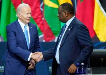 President Joe Biden shakes hands with Senegal's President Macky Sall, chair of the African Union