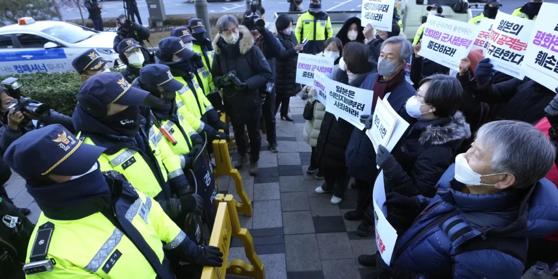 <strong>North Korea Threatens To Take Military Steps Against Japan</strong> 1 Protesters confront police officers during a rally to oppose Japan's adoption of a new national security strategy near the Japanese Embassy in Seoul, South Korea, Tuesday, Dec. 20, 2022.