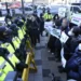 <strong>North Korea Threatens To Take Military Steps Against Japan</strong> 12 Protesters confront police officers during a rally to oppose Japan's adoption of a new national security strategy near the Japanese Embassy in Seoul, South Korea, Tuesday, Dec. 20, 2022.