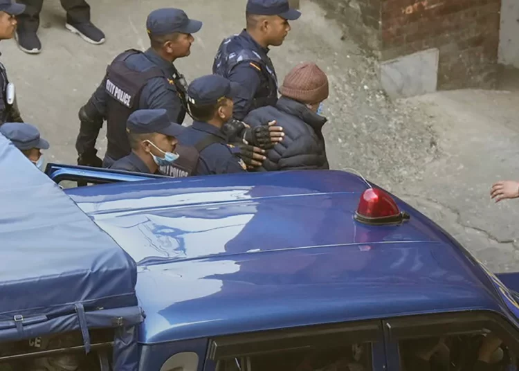 <strong>French Serial Killer Released From Nepali Jail</strong> 1 Nepalese police escort Charles Sobhraj, in brown cap, to the immigration office, in Kathmandu, Nepal, Friday, Dec. 23, 2022.