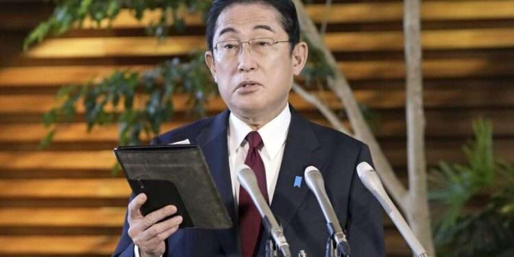 Japanese Prime Minister Fumio Kishida speaks before the media at his official residence in Tokyo, Tuesday, Dec. 27, 2022, after Kenya Akiba, minister in charge of reconstruction of Fukushima and other disaster-hit areas, submitted his resignation.