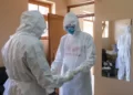 France Confirms First Ebola Case 9 Doctors wearing protective equipment pray together before they visit a patient who was in contact with an Ebola victim, in the isolation section of Entebbe Regional Referral Hospital in Entebbe, Uganda on Oct. 20, 2022.