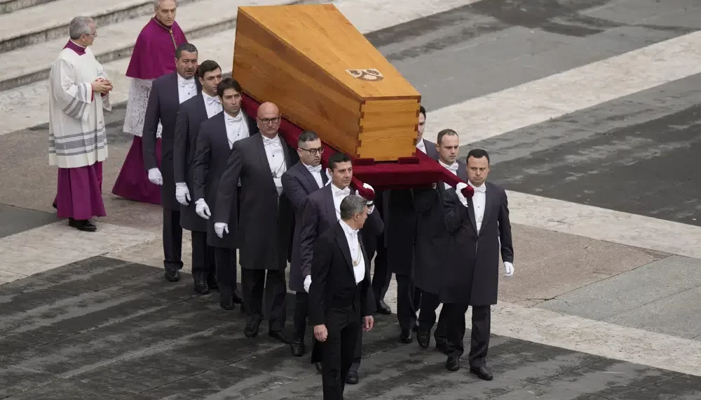 The coffin of late Pope Emeritus Benedict XVI is brought to St. Peter's Square for a funeral mass at the Vatican, Thursday, Jan. 5, 2023