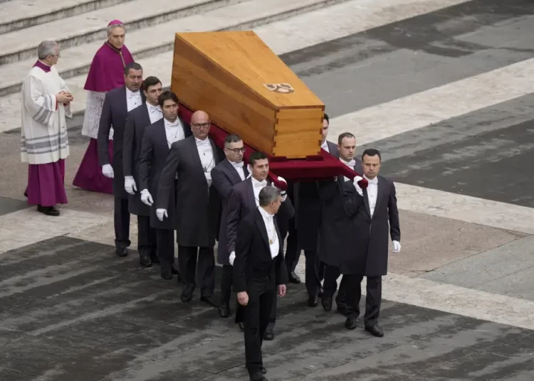 The coffin of late Pope Emeritus Benedict XVI is brought to St. Peter's Square for a funeral mass at the Vatican, Thursday, Jan. 5, 2023