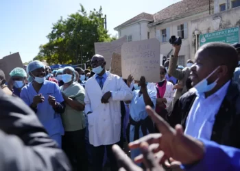 Health workers led by nurses take part in a demonstration over poor salaries at Parirenyatwa Hospital in Harare on June, 21, 2022.