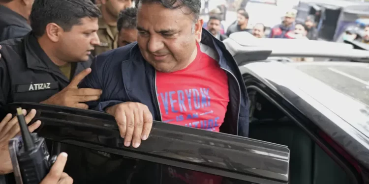 <strong>Pakistan: Senior Leader Of Imran Khan’s Party Arrested</strong> 1 Fawad Chaudhry, center, a senior leader of former Prime Minister Imran Khan's party, leaves after his medial checkup at a hospital in Lahore, Pakistan, Wednesday, Jan. 25, 2023.