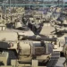 A soldier walks past a line of M1 Abrams tanks, Nov. 29, 2016, at Fort Carson in Colorado Springs