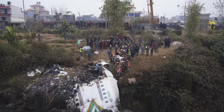 Rescuers search through wreckage of passenger plane in Pokhara