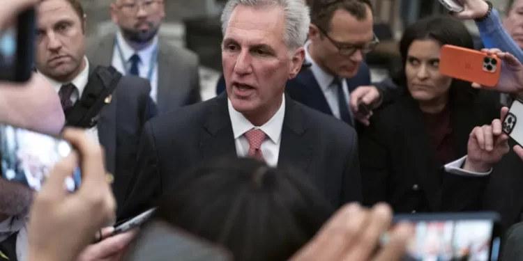 Rep. Kevin McCarthy, R-Calif., talks to reporters as he leaves the House floor after the House voted to adjourn for the evening as the House met for a third day to try and elect a speaker and convene the 118th Congress on Capitol Hill in Washington.