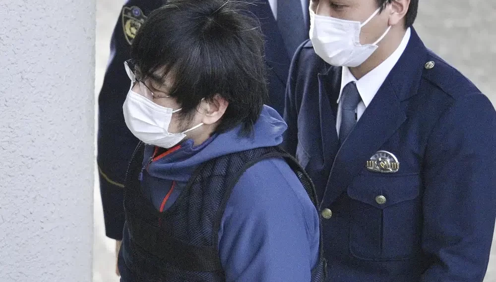 Tetsuya Yamagami, the alleged assassin of Japan's former Prime Minister Shinzo Abe, enters a police station in Nara, western Japan, on Jan. 10, 2023