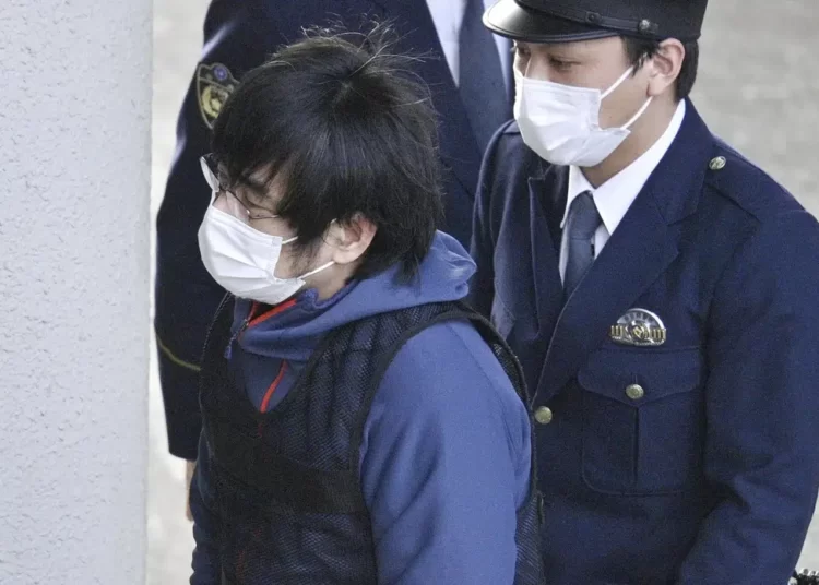 Tetsuya Yamagami, the alleged assassin of Japan's former Prime Minister Shinzo Abe, enters a police station in Nara, western Japan, on Jan. 10, 2023
