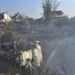 <strong>Nepal Mourns After Horrific Plane Crash Claims At Least 66 Lives</strong> 12 Locals watch the wreckage of a passenger plane as rescuers search the crash site, in Pokhara, Nepal.