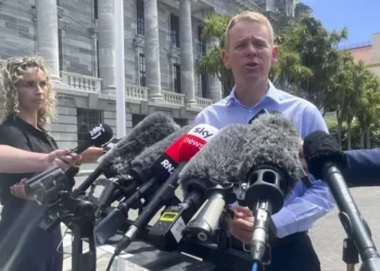 New Zealand Education Minister Chris Hipkins talks to reporters outside parliament in Wellington, New Zealand, Saturday, Jan. 21, 2023.