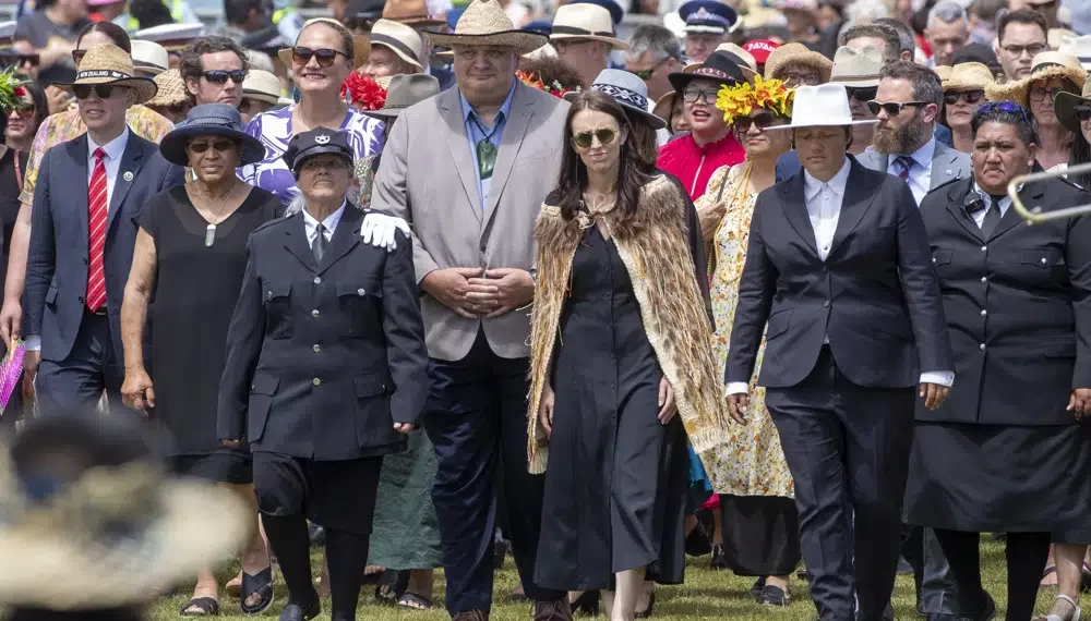 New Zealand Prime Minister Jacinda Ardern, center, and her caucus arrive at Ratana, New Zealand, Tuesday, Jan. 24, 2023