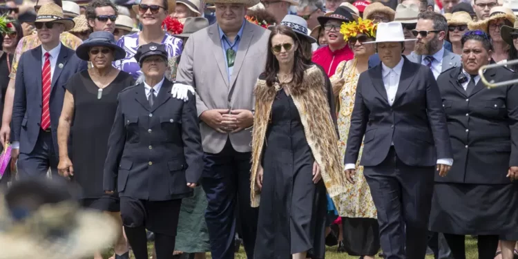 New Zealand Prime Minister Jacinda Ardern, center, and her caucus arrive at Ratana, New Zealand, Tuesday, Jan. 24, 2023