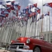 <strong>U.S Embassy In Cuba Reopens Visa And Consular Services</strong> 13 A classic American convertible car passes beside the United States embassy as Cuban flags fly at the Anti-Imperialist Tribune, a massive stage on the Malecon seaside promenade in Havana, Cuba, July 26, 2015.