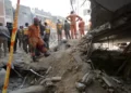 Rescue workers conduct an operation to clear the rubble and search for bodies at the site of Monday's suicide bombing, in Peshawar, Pakistan, Tuesday, Jan. 31, 2023.