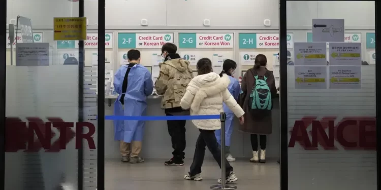 South Korea And Japan Criticize China Over Visa Stoppage 1 Passengers arriving from China prepare for their coronavirus test at a COVID-19 testing center at the Incheon International Airport In Incheon, South Korea, Tuesday, Jan. 10, 2023.