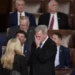 Rep. Kevin McCarthy, R-Calif., talks with Rep. Marjorie Taylor Greene, R-Ga., at the beginning of an evening session after six failed votes to elect a speaker and convene the 118th Congress in Washington, Wednesday, Jan. 4, 2023.