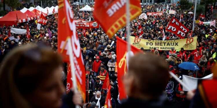 Protesters demonstrate against the French government's proposed pension reforms in Saint-Nazaire on France's west coast, as part of a day of nationwide strikes on January 19, 2023