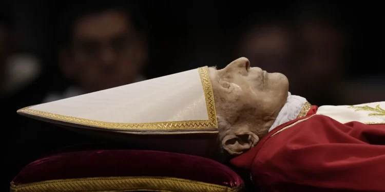 The body of late Pope Emeritus Benedict XVI laid out in state inside St. Peter's Basilica at The Vatican, Monday, Jan. 2, 2023.