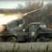 This handout photo taken from video released by Russian Defense Ministry Press Service on Oct. 4, 2022, shows a Grad multiple rocket launcher firing at Ukrainian troops at an undisclosed location.