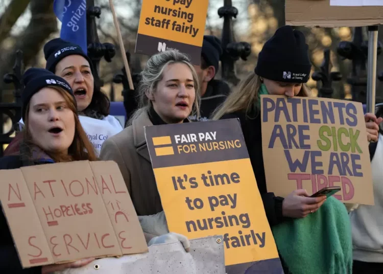 <strong>British Health Workers Stage Strike</strong> 1 Nurses of the nearby St. Thomas' Hospital stand on the picket line, in London, Monday, Feb. 6, 2023