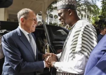 Mali's Foreign Minister Abdoulaye Diop, right, welcomes Russia's Foreign Minister Sergey Lavrov during their meeting in Bamako, Mali, Tuesday, Feb. 7, 2023.