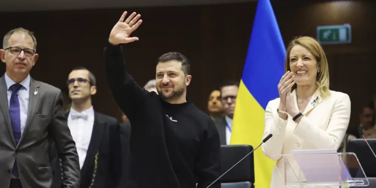 <strong>Zelenskyy Addresses EU Parliament</strong> 1 Ukraine's President Volodymyr Zelenskyy, centre, gestures as European Parliament's President Roberta Metsola, right, applauds during an EU summit at the European Parliament in Brussels, Belgium, Thursday, Feb. 9, 2023.