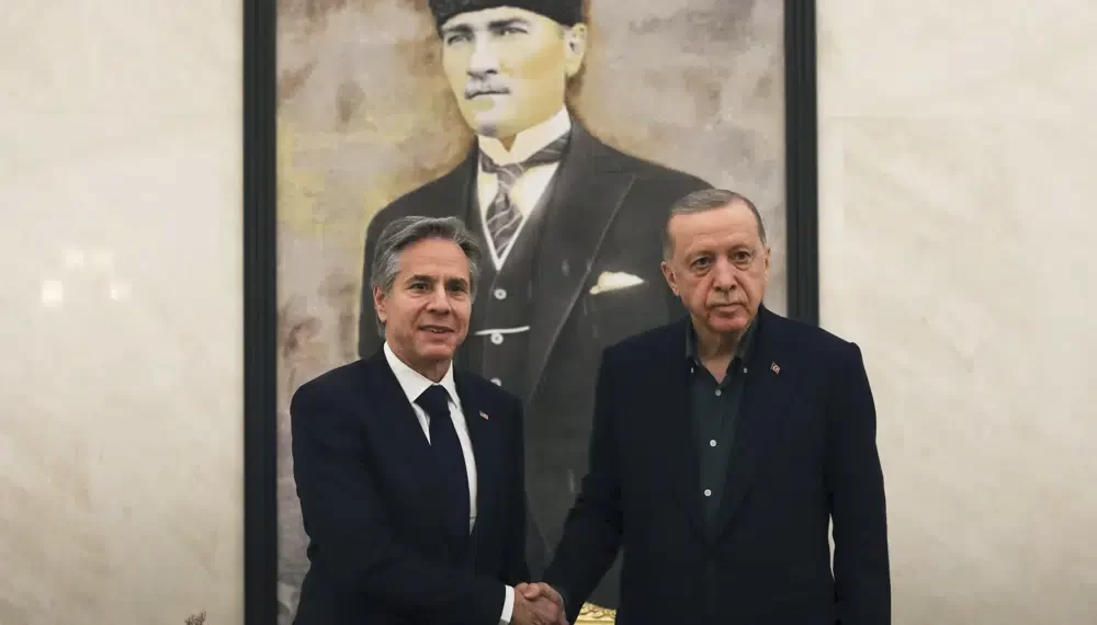 U.S. Secretary of State Antony Blinken, left, shakes hands with Turkish President Recep Tayyip Erdogan during their meeting at Esenboga airport in Ankara, Turkey, Monday, Feb. 20, 2023.