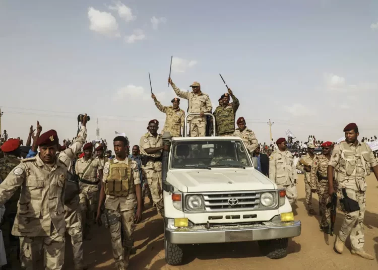 Gen. Mohammed Hamdan Dagalo, the deputy head of the military council, waves to a crowd during a military-backed tribe's rally, in the Nile River State, Sudan, Saturday, on July 13, 2019.