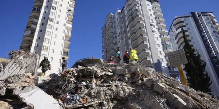 <strong>Turkey-Syria Earthquake: Search Intensifies As Death Toll Escalates To More Than 5,000</strong> 1 Emergency teams search for people in the rubble of a destroyed building in Adana, southern Turkey, Tuesday, Feb. 7, 2023