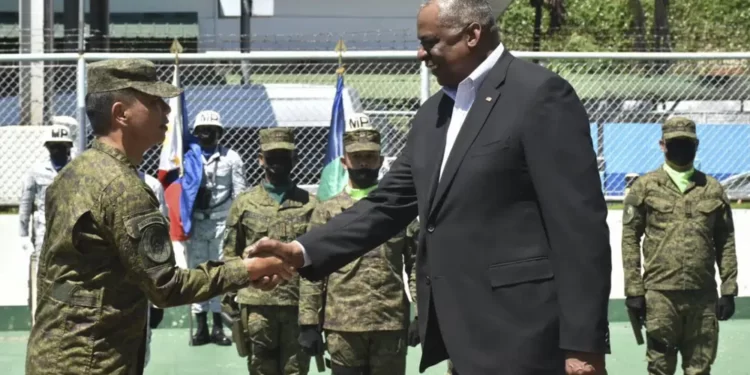 <strong>U.S Defense Secretary In Philippines To Discuss Deployment Of More American Troops</strong> 1 In this handout photo provided by the Command Public Information Office, Western Mindanao Command, U.S. Defense Secretary Lloyd Austin III, right, greets Western Mindanao Commander Lt. Gen. Roy Galido as he visits Camp Don Basilio Navarro in Zamboanga province, southern Philippines