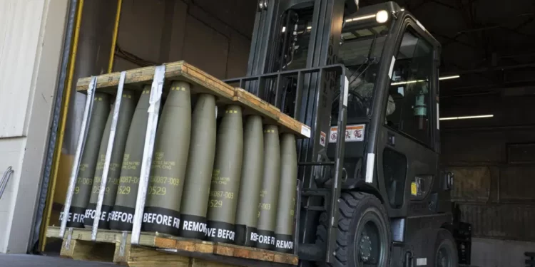 Airmen with the 436th Aerial Port Squadron use a forklift to move 155 mm shells ultimately bound for Ukraine, April 29, 2022, at Dover Air Force Base, Del.
