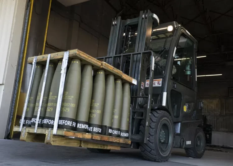 Airmen with the 436th Aerial Port Squadron use a forklift to move 155 mm shells ultimately bound for Ukraine, April 29, 2022, at Dover Air Force Base, Del.