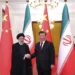 President Ebrahim Raisi, left, shakes hands with his Chinese counterpart Xi Jinping in an official welcoming ceremony in Beijing