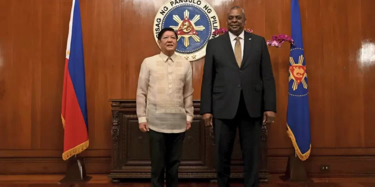 U.S. Secretary of Defense Lloyd James Austin III, right, poses with Philippine President Ferdinand Marcos Jr during a courtesy call at the Malacanang Palace in Manila, Philippines