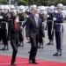 Taiwan's President Tsai Ing-wen, left, and Paraguay's President Mario Abdo Benitez walk past an honor guard at the Presidential House in Taipei, Taiwan, Thursday, Feb. 16, 2023.