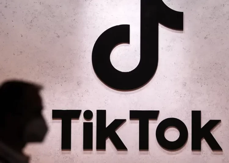 <strong>China Reacts To Tiktok Ban On U.S Government Devices, Says It Reflects Insecurities</strong> 1 A visitor passes the TikTok exhibition stands at the Gamescom computer gaming fair in Cologne, Germany, Thursday, Aug. 25, 2022.