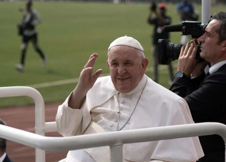 Pope Francis waves at worshipers at the Martyrs’ Stadium in Kinshasa, Congo
