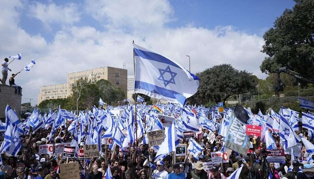 Israelis protest against Prime Minister Benjamin Netanyahu's judicial overhaul plan outside the parliament in Jerusalem, Monday, March 27, 2023.