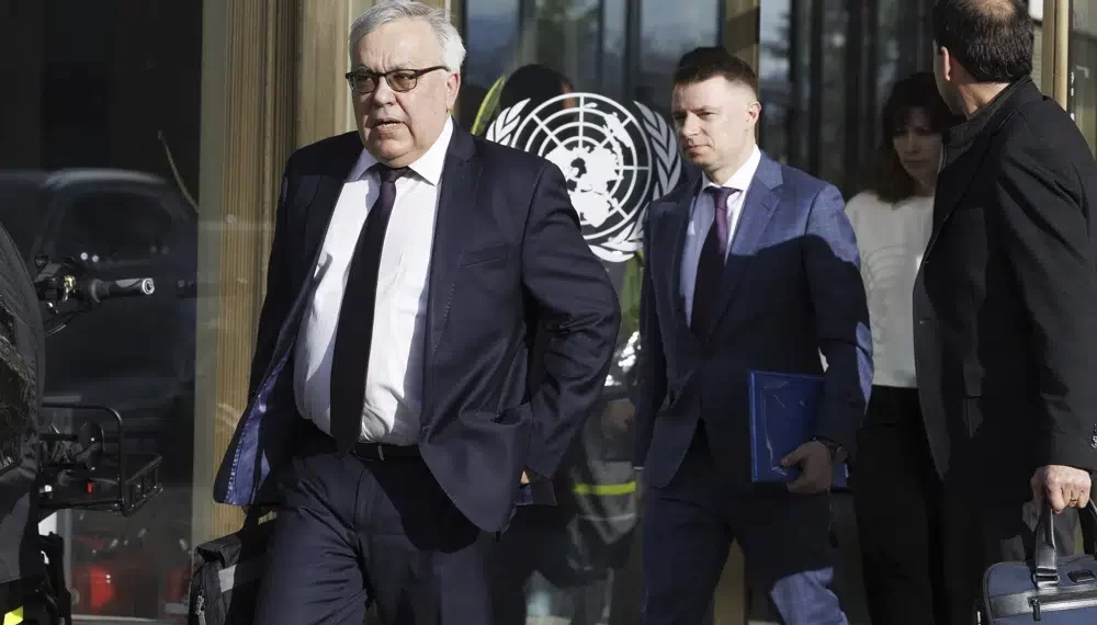 Russia's Deputy Foreign Minister Sergei Vershinin, left, leaves the U.N. building after a meeting with the U.N. officials for talks on Black Sea Grain Initiative, at the European headquarters of the United Nations in Geneva, Switzerland