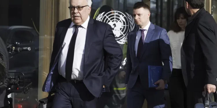 Russia's Deputy Foreign Minister Sergei Vershinin, left, leaves the U.N. building after a meeting with the U.N. officials for talks on Black Sea Grain Initiative, at the European headquarters of the United Nations in Geneva, Switzerland