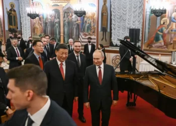 Chinese President Xi Jinping, center left, and Russian President Vladimir Putin, right, walk after their dinner at The Palace of the Facets in the Moscow Kremlin, Russia, Tuesday, March 21, 2023.