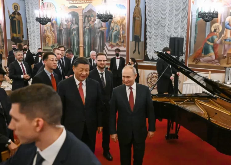 China Labels Xi’s Visit To Moscow As “A Journey Of Friendship” 1 Chinese President Xi Jinping, center left, and Russian President Vladimir Putin, right, walk after their dinner at The Palace of the Facets in the Moscow Kremlin, Russia, Tuesday, March 21, 2023.