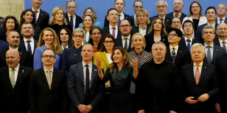 A family photo of those attending the International Justice Minister's Conference at Lancaster House in London, Monday, March 20, 2023. Including at front Dominic Rabb, Britain's Deputy Prime Minister and Minister of Justice, 3rd left, Minister of Justice and Security of the Netherlands, Minister Dilan Yesilgöz-Zegerius , 3rd right, Minister of Justice of Ukraine, Denys Maliuska, 2rd left, Prosecutor General of Ukraine, Andriy Kostin, 2nd right, Karim Khan KC, Prosecutor of the ICC,left, and The European Commissioner, Dider Reynders at right.