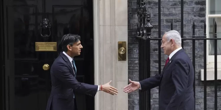Britain's Prime Minister Rishi Sunak, left, welcomes Israel Prime Minister Benjamin Netanyahu at Downing Street in London, Friday, March 24, 2023.