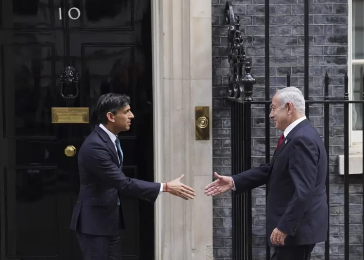 Britain's Prime Minister Rishi Sunak, left, welcomes Israel Prime Minister Benjamin Netanyahu at Downing Street in London, Friday, March 24, 2023.